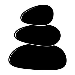 Smooth black pebbles stacked in zen stone silhouette