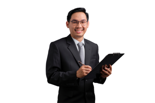 Confident Asian businessman in suit holding clipboard and writing, isolated on transparent background
