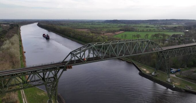 high bridge over the Kiel canal, ships transportation over inland waterway. Germany. Aerial view. Logisitcs and transport