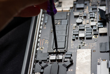 close up of Technician repairing electronic circuit board, repairing, upgrade and technology.