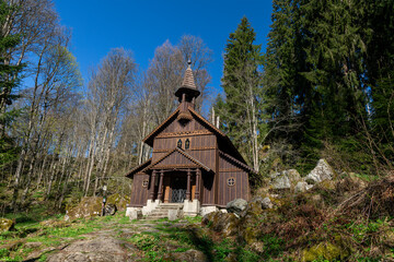 Old wooden pilgrimage rural Chapel of Virgin Mary (Stožecká kaple in Czech) standing in a forest of Šumava National Park - Stožec, Czech Republic, Europe