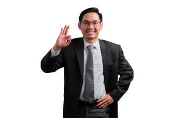 Confident young Asian businessman giving a thumbs up gesture, smiling and positive, isolated on...