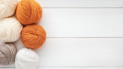 Colorful yarn balls arranged on a wooden surface suitable for knitting and crafting projects