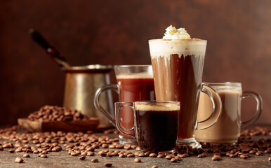 Various coffee and chocolate drinks on a brown background.