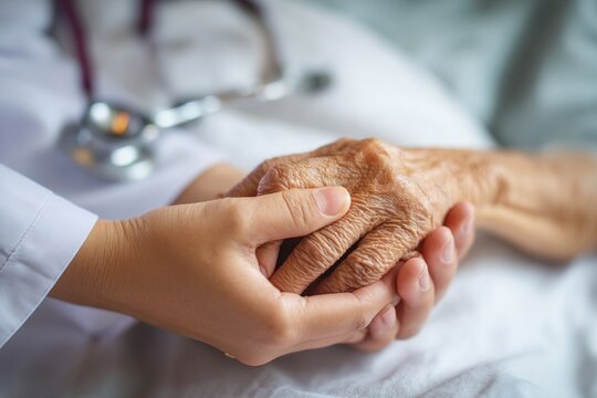 Parkinson and alzheimer female senior elderly patient holding hand with physician doctor in hospice care. Medical healthcare concept