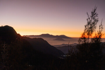 Majestic sunrise illuminating mountain peaks in indonesia