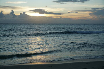 Obraz premium Sunset at the beach scenic seaside nature photography calm ocean wide angle tranquility and reflection