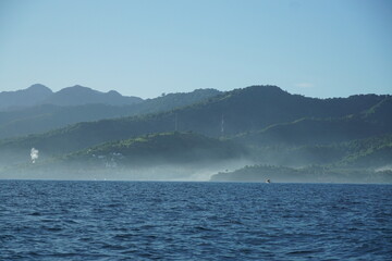 Tranquil sea view over misty hills coastal location landscape photography natural environment serene concept