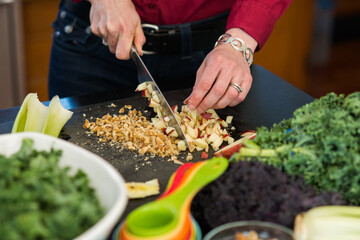 Chopping Apples and Walnuts for a Fresh Kale Salad