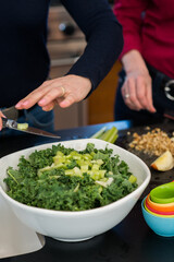 Chopping Celery for a Fresh Kale Salad in the Kitchen