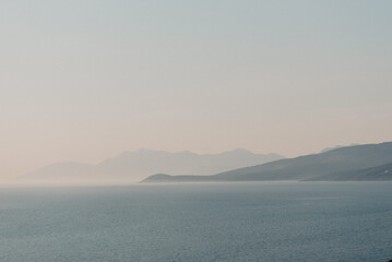 Albanian Coastline: Misty Mountain Silhouettes at Dawn