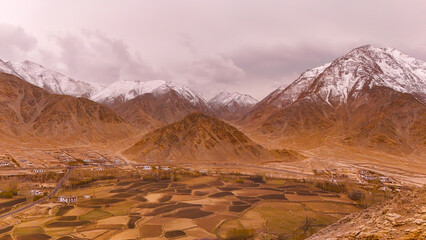 ariel view of snow capped laddakh mountains and dessert