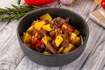 Rogiut with meat, potato and tomatoes