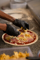 Placing Pineapple on Pizza with Both Hands
