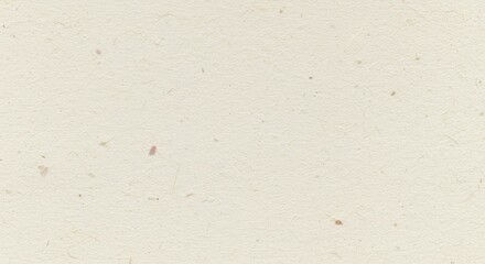 Obraz premium Close-up view of a light beige recycled paper texture with subtle dark flecks and a slightly rough, uneven surface, providing a natural and eco-friendly background.