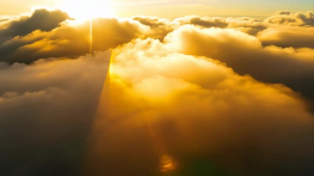 Sun rays pierce through a mix of bright sun and soft clouds