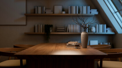 A coffee cup on wooden table and armchairs next to a bookshelf in a dim room with roof window.