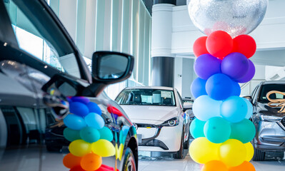 Car parked in luxury showroom. Car dealership office. Car showroom business. New car parked in...