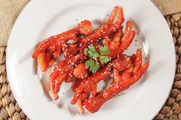 Spicy stir-fried chicken feet dish. processed chicken dishes