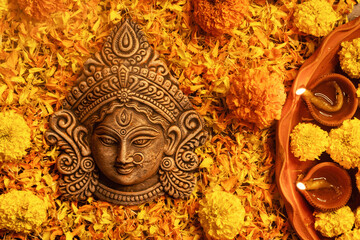 Stunning Goddess Durga with festive marigold flowers and illuminated background.Ideal for Durga...