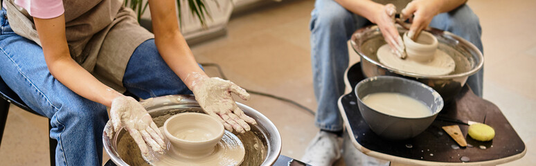 Young couple creating pottery together in a vibrant art studio filled with creativity and love