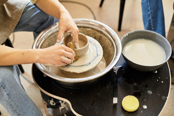 Crafting unique pottery pieces in a vibrant and inspiring studio filled with creativity