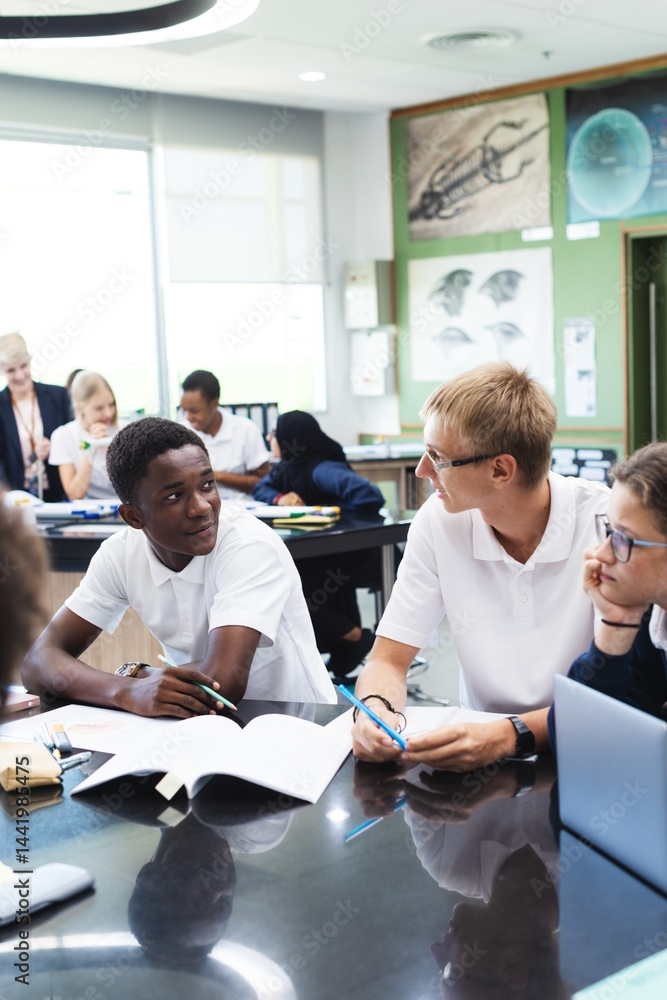 Poster Students in a classroom discussing a project. Diverse group of students engaged in learning. Classroom setting with students collaborating on work. Diverse students in classroom, education.