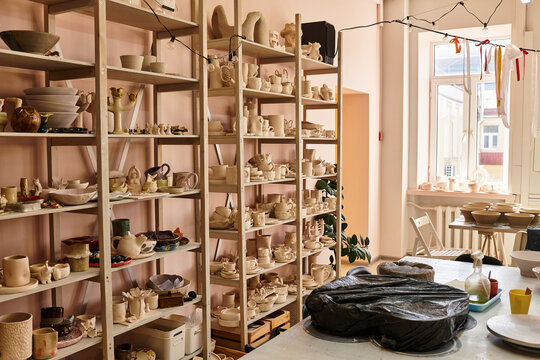 A vibrant pottery studio bursts with unique sculptures and creative expressions