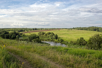 Dirt road in the countryside on a cloudy day