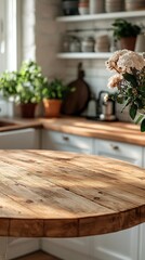 An empty wooden tabletop counter awaits use in a bright and clean kitchen. The surrounding green plants add freshness, setting a perfect backdrop for product presentation