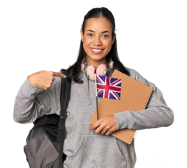 Young Filipino Erasmus student person pointing by hand to a shirt copy space, proud and confident