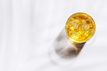 A glass of whiskey placed on a white background