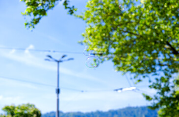Soap bubbles in the air at Swiss City of Zürich at town square named Bellevue on a sunny spring day. Photo taken April 28th, 2025, Zurich, Switzerland.