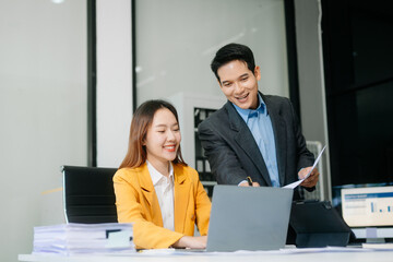 Kind leader executive manager share and discuss business solutions plan ideas on tablet with Asian...