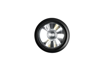 Powerful LED flashlight head close up bright light beam black casing white background