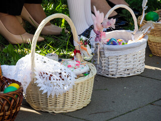 Traditional White Easter Baskets Filled with Colorful Eggs and Treats Ready for Orthodox Blessing...