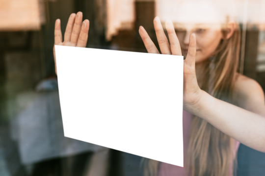 Sign png mockup, girl showing paper through glass window