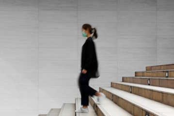 Wall png transparent mockup with woman walking down the stairs