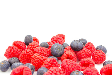 fresh forest blueberry and raspberry isolated on white background, Fresh ripe berry on a white background. 