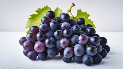 Fototapeta premium Black Magic grape set on a white surface.