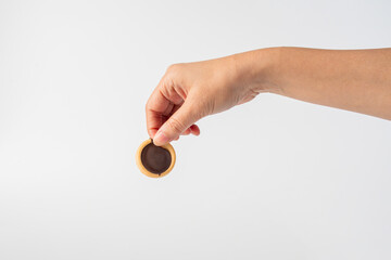 Sweet Bakery Cookies with chocolate and hand on white background