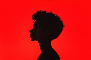 Woman in silhouette on red background