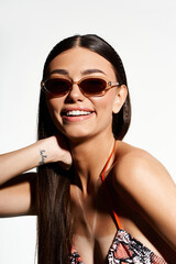 Radiating summer vibes with stylish sunglasses and a sun-kissed glow