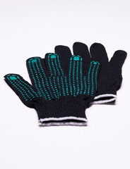 Pair of black work gloves with green rubber grip dots, front and back view on white background