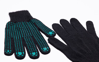 Pair of black work gloves with green rubber grip dots, front and back view on white background
