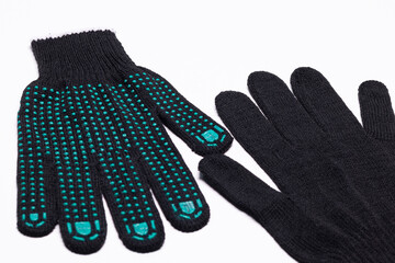 Pair of black work gloves with green rubber grip dots, front and back view on white background