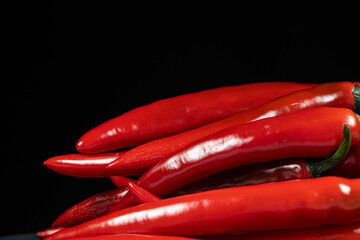 Fresh Red Chili Peppers on Black Background Copy Space