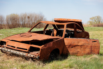 Abandoned, shot rusty vehicle car