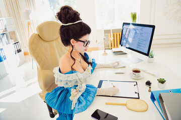 Modern businesswoman in historical attire working in an elegant office, reflecting a blend of...