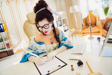 Elegant woman dressed in historical costume signing documents in modern office merging classic...